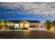 Single-story home with a two-car garage, landscaping, and a neutral color palette at 156 Ozuna Ct, Las Vegas, NV 89183