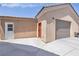 Home exterior with attached garage and landscaping at 156 Ozuna Ct, Las Vegas, NV 89183