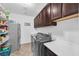 Laundry room with washer, dryer, and shelving at 156 Ozuna Ct, Las Vegas, NV 89183