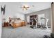 Bright main bedroom with wood bed frame and carpeted floor at 156 Ozuna Ct, Las Vegas, NV 89183