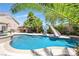 Large inviting pool with a waterslide and basketball hoop at 156 Ozuna Ct, Las Vegas, NV 89183