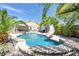 Inviting backyard pool with spa and waterslide; perfect for entertaining at 156 Ozuna Ct, Las Vegas, NV 89183