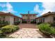 Outdoor patio area with fireplace and stone pathway at 1788 Amarone Way, Henderson, NV 89012