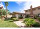 Backyard with stone pathway, hot tub, and landscaping at 1788 Amarone Way, Henderson, NV 89012