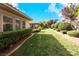 Long, grassy backyard with hedges and landscaping at 1788 Amarone Way, Henderson, NV 89012