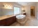 Elegant bathroom with soaking tub and double vanity at 1788 Amarone Way, Henderson, NV 89012