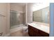 Clean bathroom with a shower/tub combo, vanity, and tile flooring at 1788 Amarone Way, Henderson, NV 89012