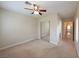 Spacious bedroom with mirrored closet doors and access to a bathroom at 1788 Amarone Way, Henderson, NV 89012