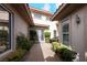 Elegant entryway with double doors and lush landscaping at 1788 Amarone Way, Henderson, NV 89012