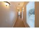 Bright hallway with tile flooring and light fixtures at 1788 Amarone Way, Henderson, NV 89012