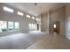 Spacious living room with high ceilings and tile and carpet flooring at 1788 Amarone Way, Henderson, NV 89012