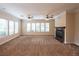 Spacious living room with fireplace and large windows at 1788 Amarone Way, Henderson, NV 89012