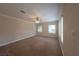 Spacious living room featuring neutral walls, carpet flooring, and multiple windows at 1788 Amarone Way, Henderson, NV 89012