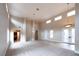 High-ceilinged living room featuring hardwood floors and plenty of natural light at 1788 Amarone Way, Henderson, NV 89012