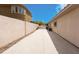 Side yard with concrete driveway and gated access at 1788 Amarone Way, Henderson, NV 89012