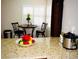 Kitchen breakfast nook with granite countertop and bar stools at 1972 Weenap Dr, Las Vegas, NV 89108