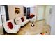 Modern living room with white leather furniture and red accents at 1972 Weenap Dr, Las Vegas, NV 89108