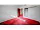 Spacious bedroom with red carpet and mirrored closet at 2105 Berkley Ave, Las Vegas, NV 89101