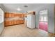 Basic kitchen with wood cabinets and white appliances at 2105 Berkley Ave, Las Vegas, NV 89101