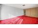 Living area with red carpet and wood-paneled accent wall at 2105 Berkley Ave, Las Vegas, NV 89101