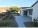 Spacious backyard with patio, landscaping, and mountain views at 2416 Weaverville Dr, Henderson, NV 89044