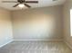 Bright bedroom with ceiling fan and neutral wall-to-wall carpeting at 2416 Weaverville Dr, Henderson, NV 89044