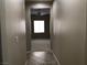 Bright hallway with tile flooring and neutral walls at 2416 Weaverville Dr, Henderson, NV 89044