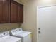 Laundry room with washer, dryer, and cabinets at 2416 Weaverville Dr, Henderson, NV 89044