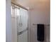 Bathroom with a shower stall and white tiled walls at 2525 Huber Heights Dr, Las Vegas, NV 89128