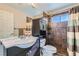 Well-appointed bathroom with dark tile shower and vanity at 2525 Huber Heights Dr, Las Vegas, NV 89128