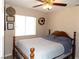 Bedroom with wooden bed frame and large window at 2525 Huber Heights Dr, Las Vegas, NV 89128