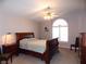 Main bedroom with large window, wooden sleigh bed and plenty of space at 2525 Huber Heights Dr, Las Vegas, NV 89128