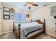 Charming bedroom with wooden bed frame and ceiling fan at 2525 Huber Heights Dr, Las Vegas, NV 89128