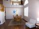 Open dining room with hardwood floors, a chandelier, and a view to the second floor at 2525 Huber Heights Dr, Las Vegas, NV 89128