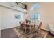 Formal dining room with hardwood floors and large windows at 2525 Huber Heights Dr, Las Vegas, NV 89128