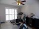 Bright home gym with treadmill, weights, and window at 2525 Huber Heights Dr, Las Vegas, NV 89128