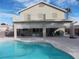 Two-story house with covered patio and pool at 2525 Huber Heights Dr, Las Vegas, NV 89128