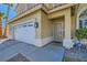 Front entrance with security door and landscaping at 2525 Huber Heights Dr, Las Vegas, NV 89128