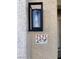 Modern house number plaque with stylish light fixture at 2525 Huber Heights Dr, Las Vegas, NV 89128