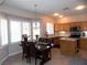 Kitchen with stainless steel appliances and breakfast nook with pool view at 2525 Huber Heights Dr, Las Vegas, NV 89128