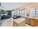 Kitchen island with stainless steel dishwasher and view into living room at 2525 Huber Heights Dr, Las Vegas, NV 89128