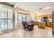 Bright kitchen nook with wood table and chairs, plus access to backyard at 2525 Huber Heights Dr, Las Vegas, NV 89128