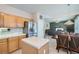 Kitchen features island, stainless steel appliances and wood cabinets at 2525 Huber Heights Dr, Las Vegas, NV 89128