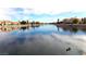 Calm lake with waterfront homes reflecting in the water at 2525 Huber Heights Dr, Las Vegas, NV 89128