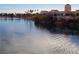 Tranquil lake view with waterfront restaurants and palm trees at 2525 Huber Heights Dr, Las Vegas, NV 89128