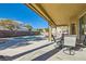 Covered patio with table and chairs at 2525 Huber Heights Dr, Las Vegas, NV 89128