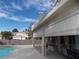 Extended patio with retractable awnings and pool views at 2525 Huber Heights Dr, Las Vegas, NV 89128