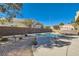 Landscaped backyard with inviting pool at 2525 Huber Heights Dr, Las Vegas, NV 89128