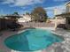 Relaxing kidney shaped pool with patio furniture at 2525 Huber Heights Dr, Las Vegas, NV 89128