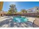 Inviting kidney-shaped pool with concrete decking at 2525 Huber Heights Dr, Las Vegas, NV 89128